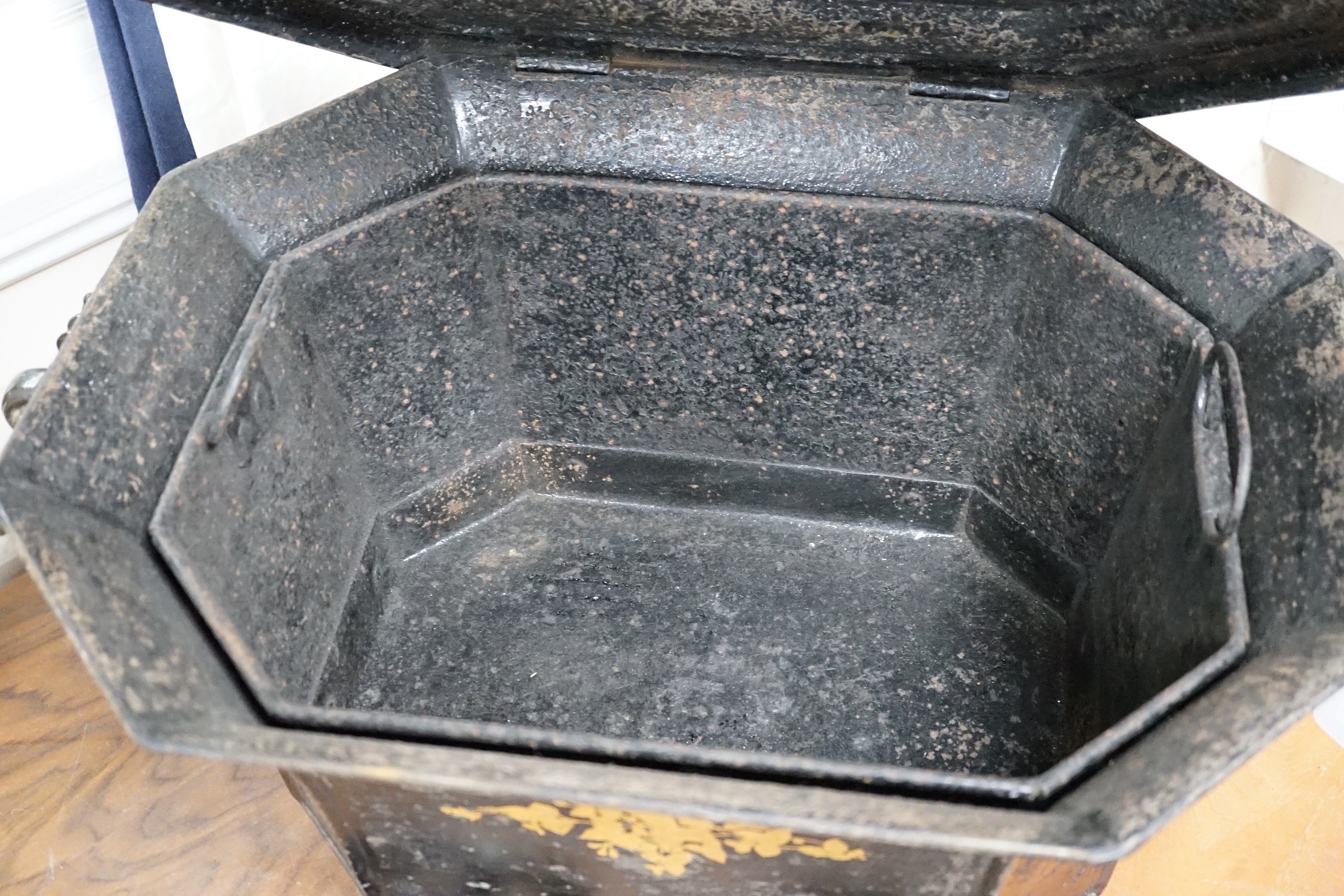 A Victorian gilt lacquer coal scuttle on wheels with glass inset top, 63cm long